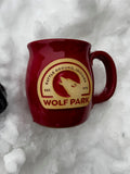 Red mug with a logo on a snowy background